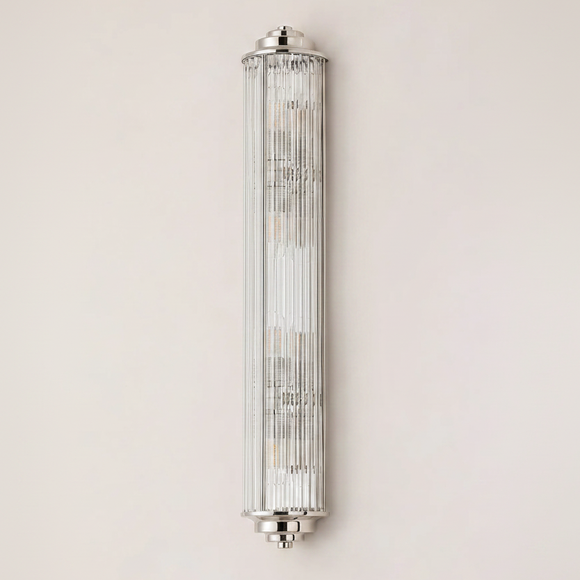 Polished nickel wall light with a fluted glass shade