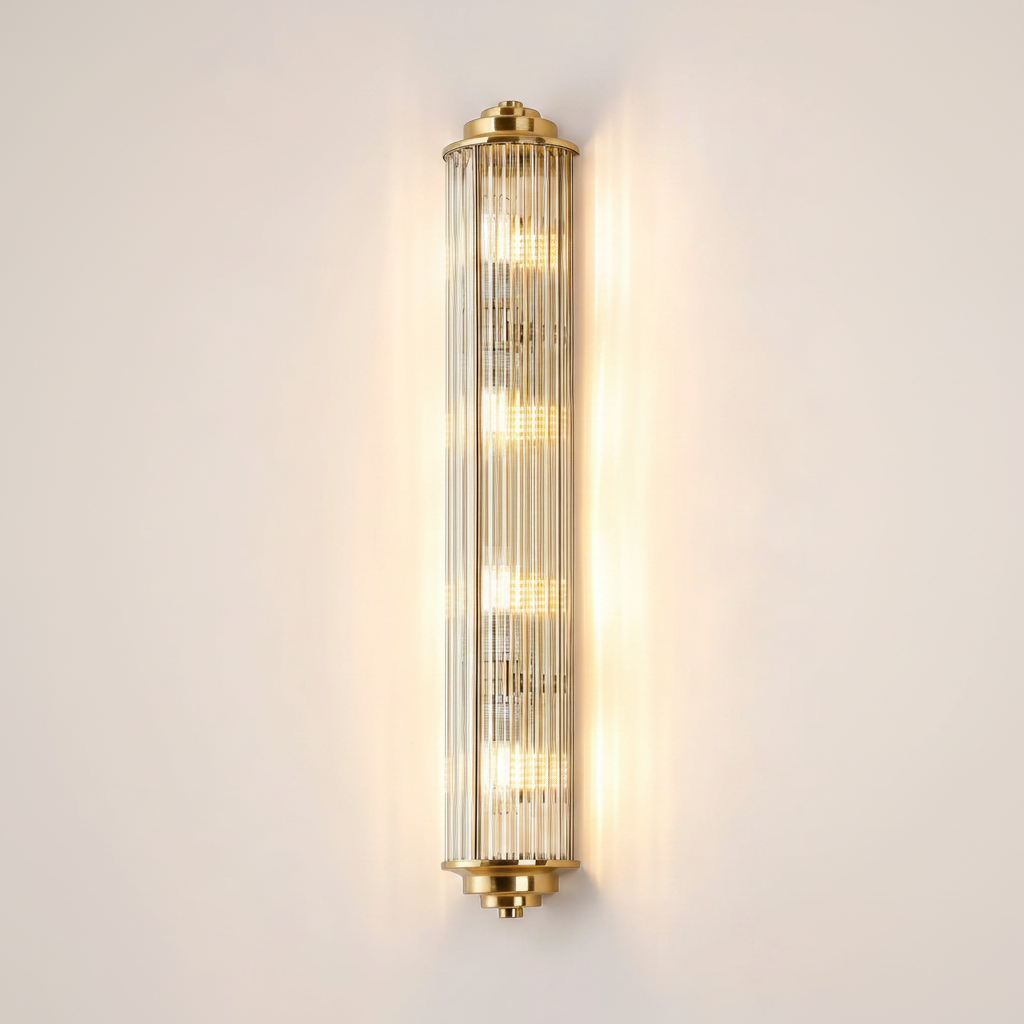 Vertical brass and fluted glass wall sconce with five illuminated bulbs