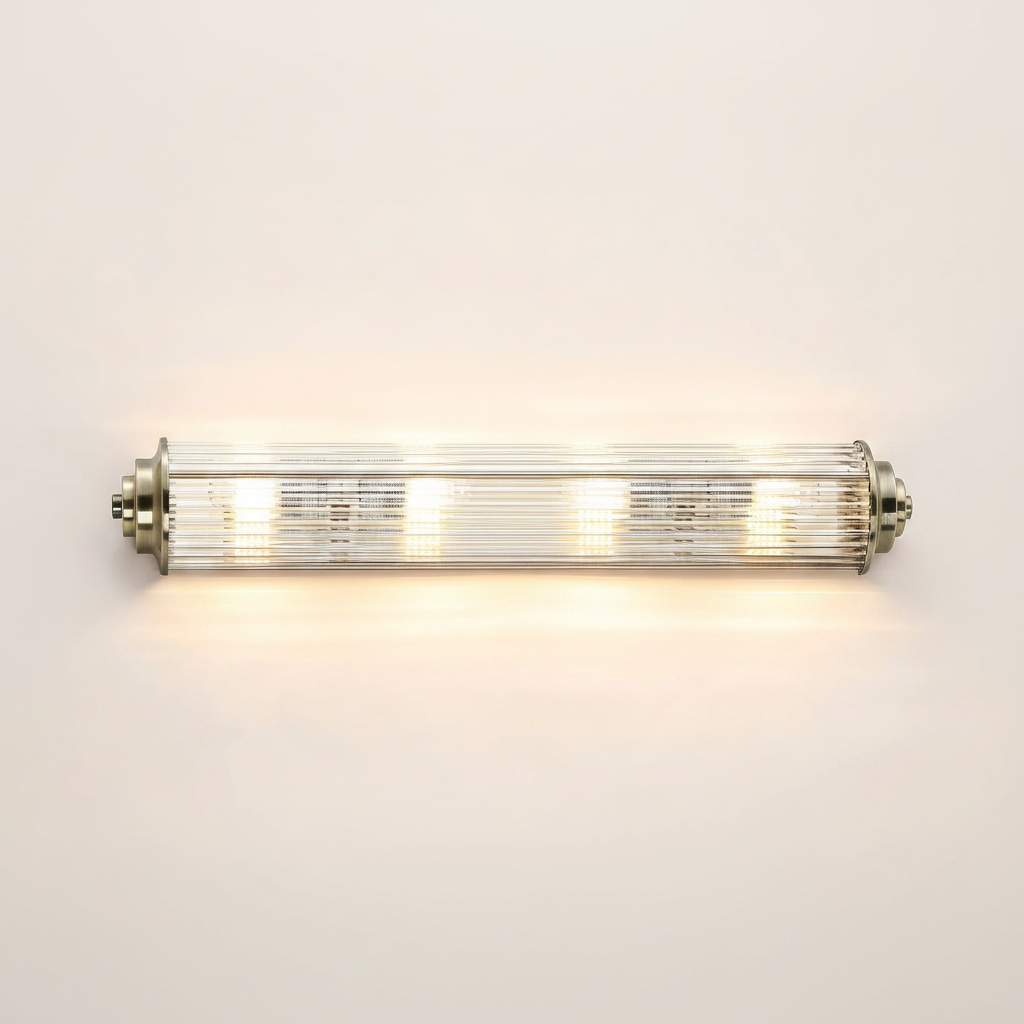 A horizontal vanity light with a brushed nickel finish and clear fluted glass shades
