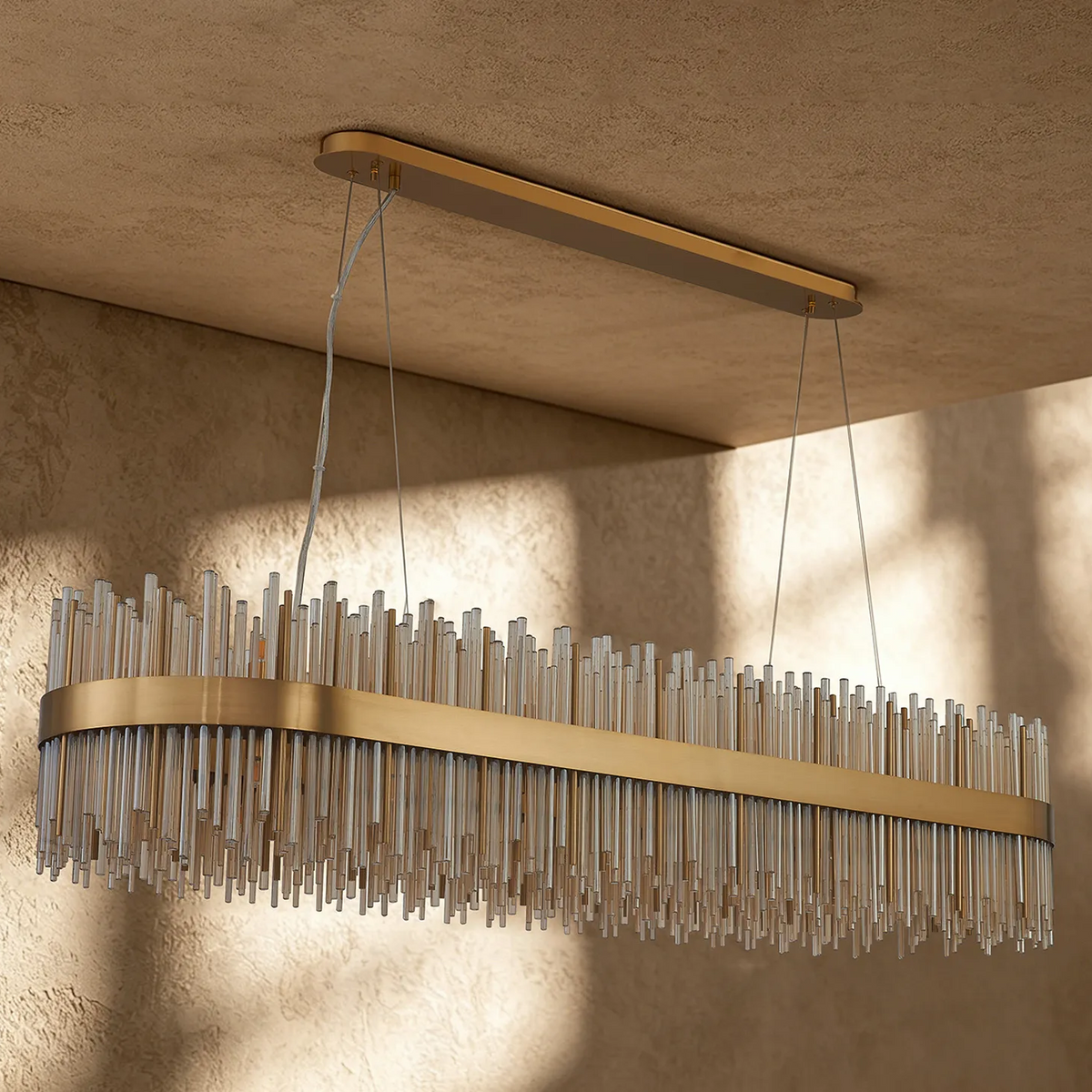 Rectangular chandelier with a gold frame and clear glass rods of varying lengths