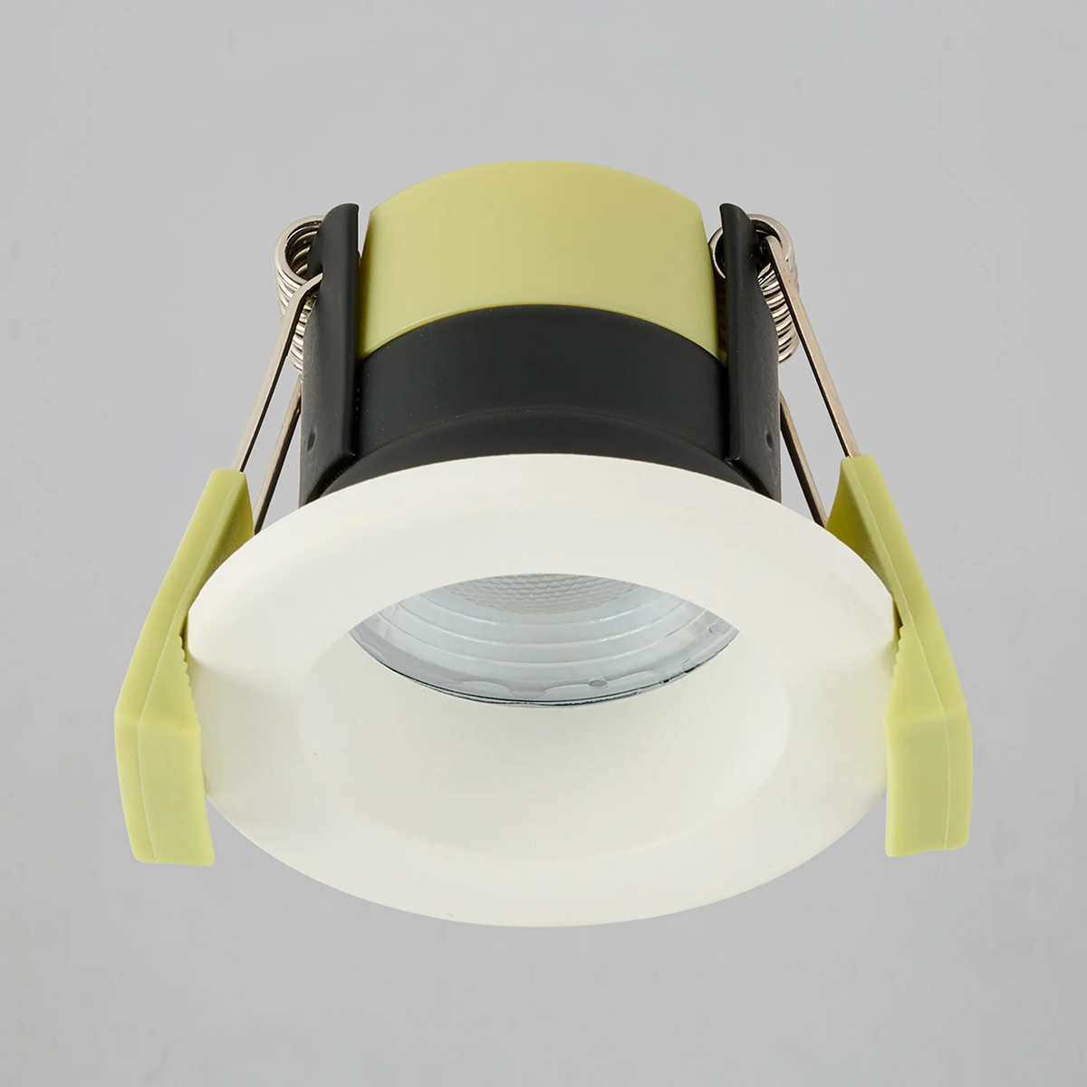 Recessed light with a white trim and lime green clips, light is off