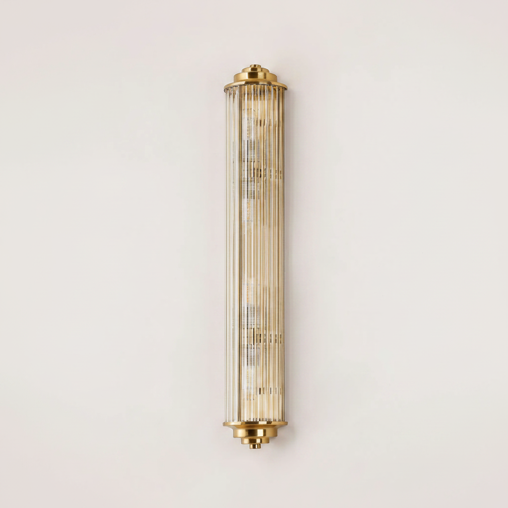 Tall cylindrical wall sconce with fluted glass and brass accents