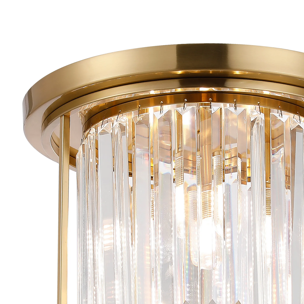 Close-up of a gold and crystal chandelier with light bulbs visible through the clear crystal rods