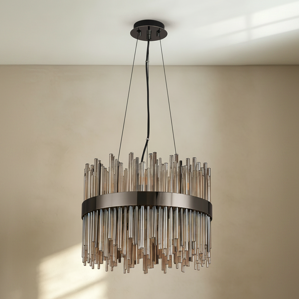 Round chandelier with a black metal frame and clear glass rods hanging at varying lengths