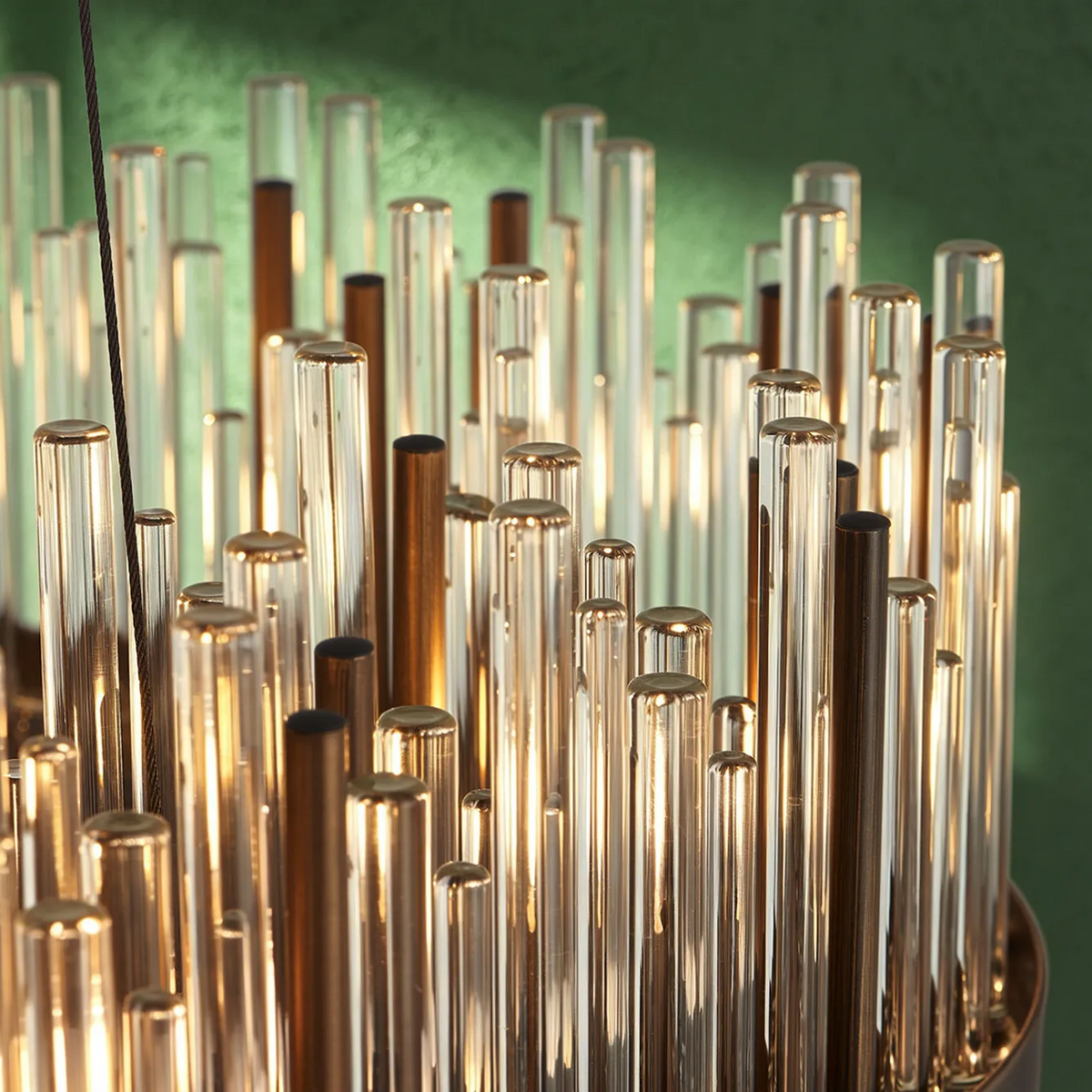 Close up of a chandelier with clear and bronze glass rods