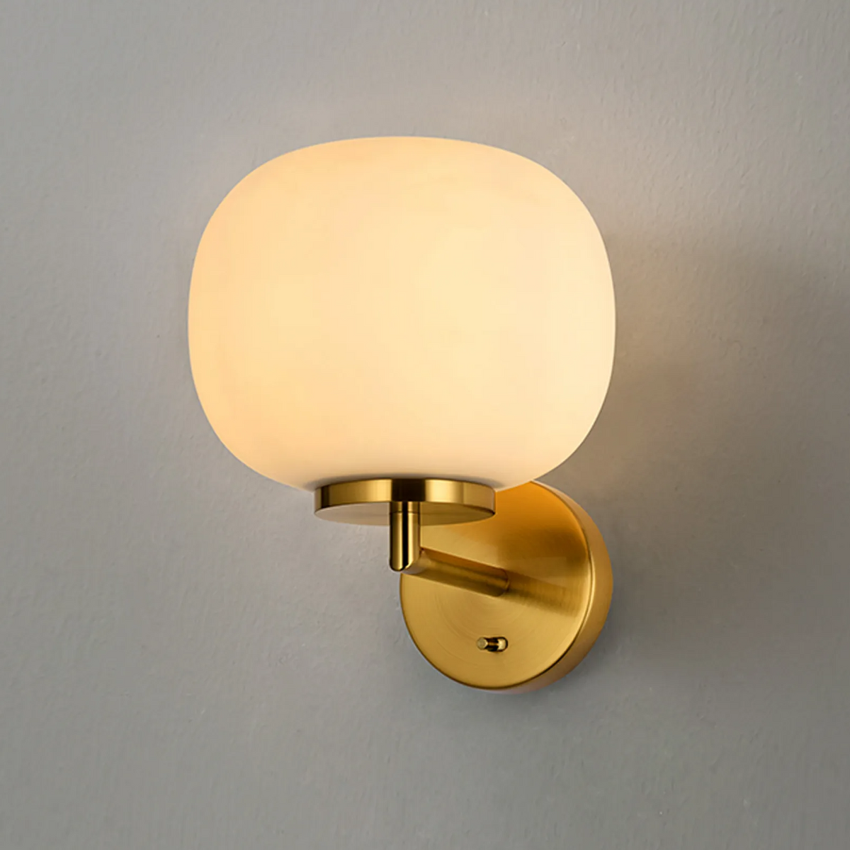 Milton Small Oval Ball Switched Wall Light in Aged Brass & Frosted White Shade