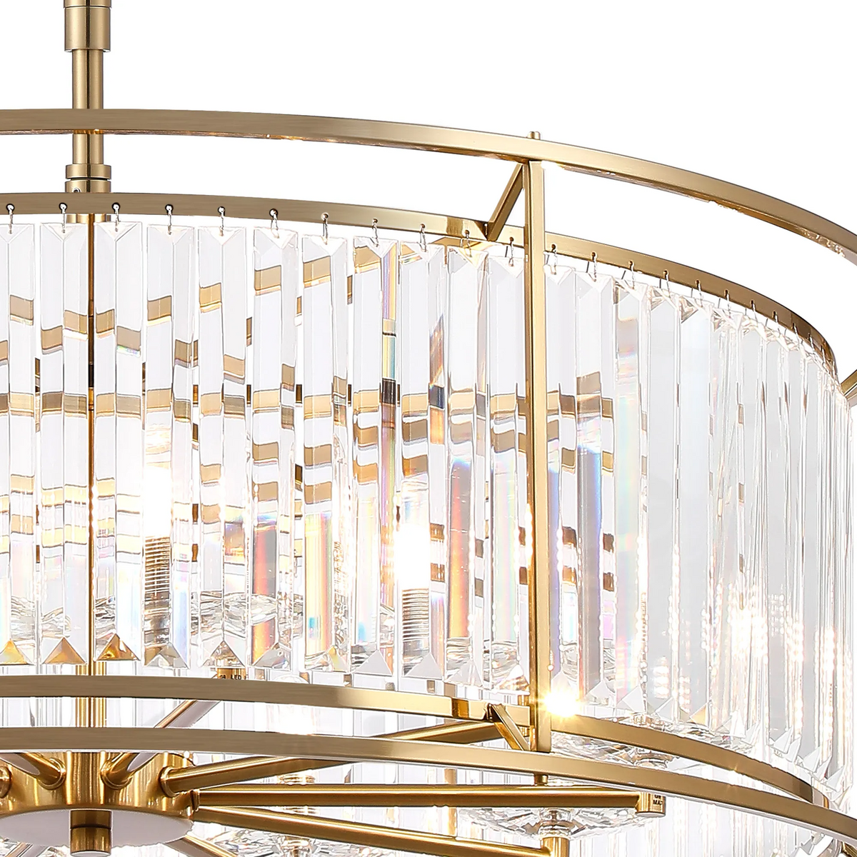 Close up of a gold chandelier with clear crystal rods hanging from a gold frame