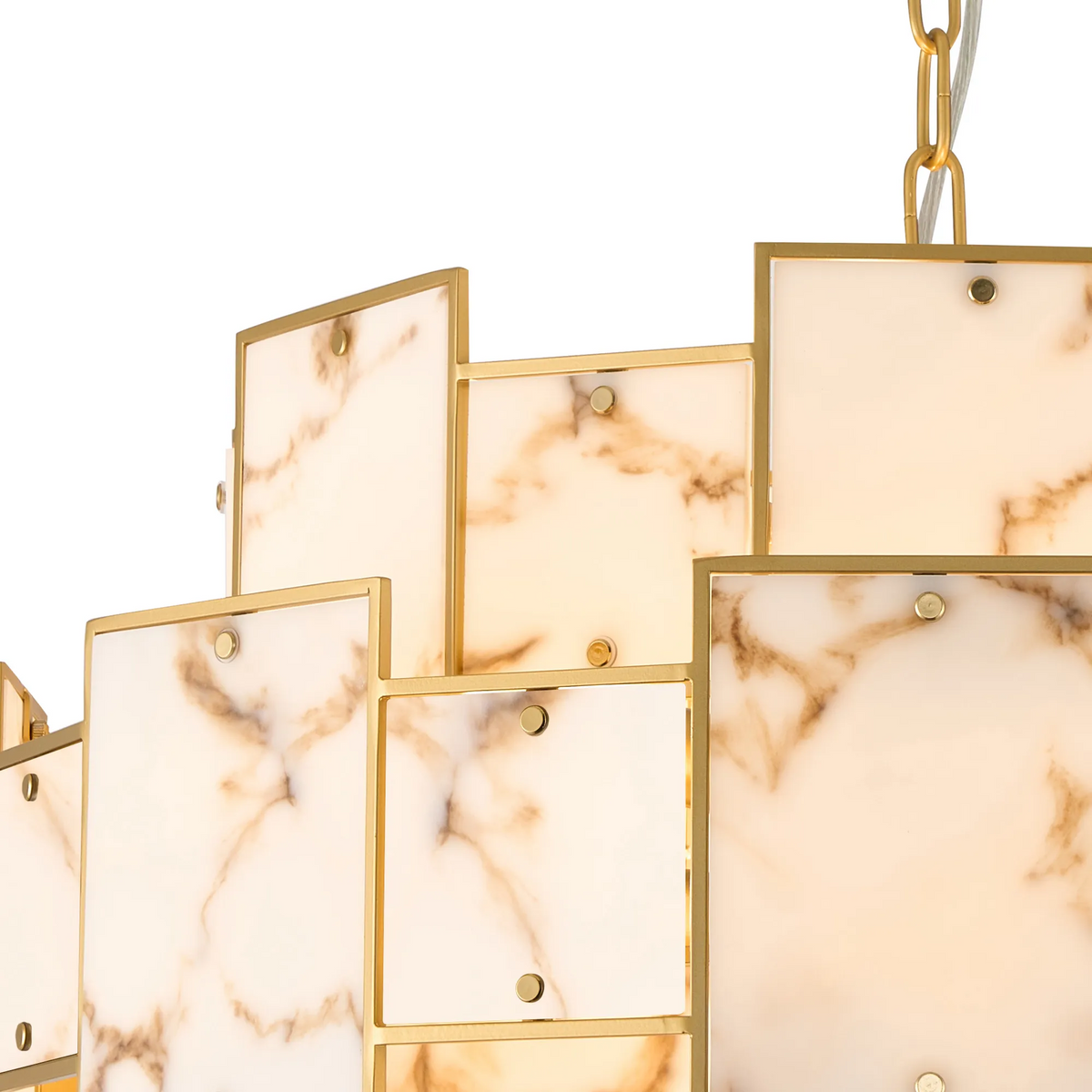 Close up of a chandelier with gold frames and white marble panels