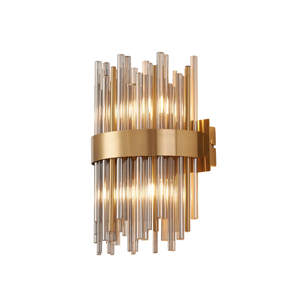 A wall sconce with a brass band holding clear and amber glass rods, illuminated from within