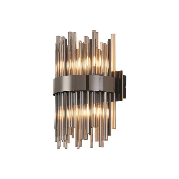 Wall sconce with vertical glass rods in varying lengths, a dark metal band, and illuminated bulbs