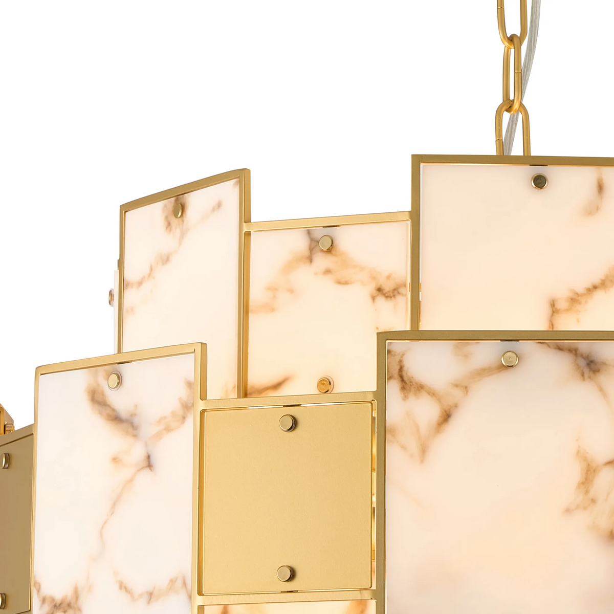 Close up of a gold chandelier with rectangular marble panels