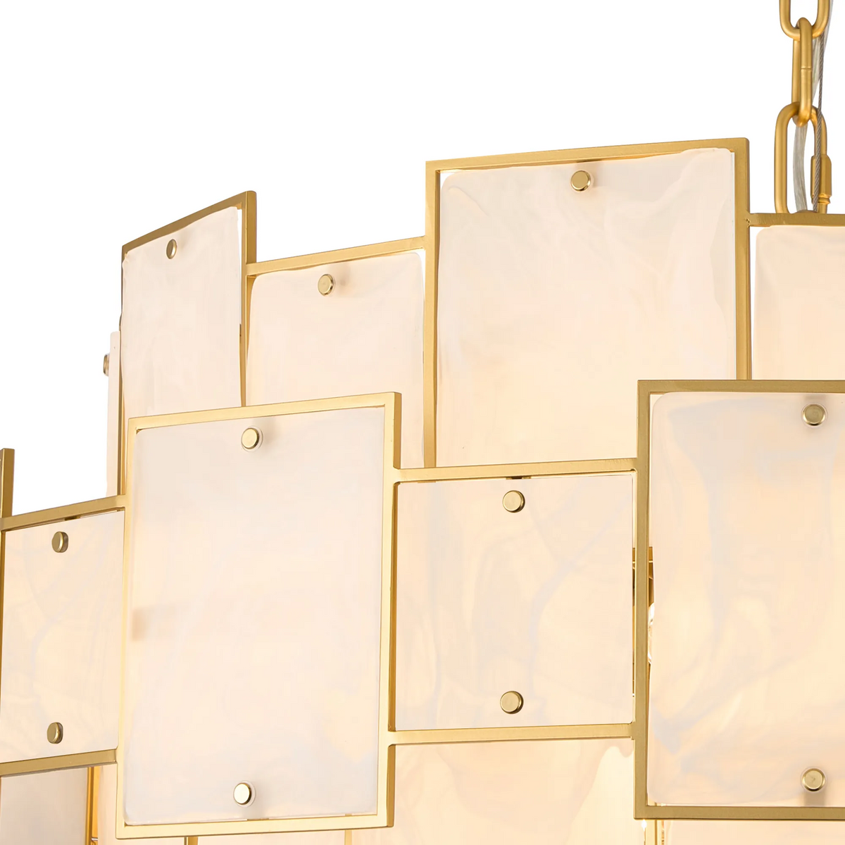 Close up of a gold chandelier with rectangular white glass panels