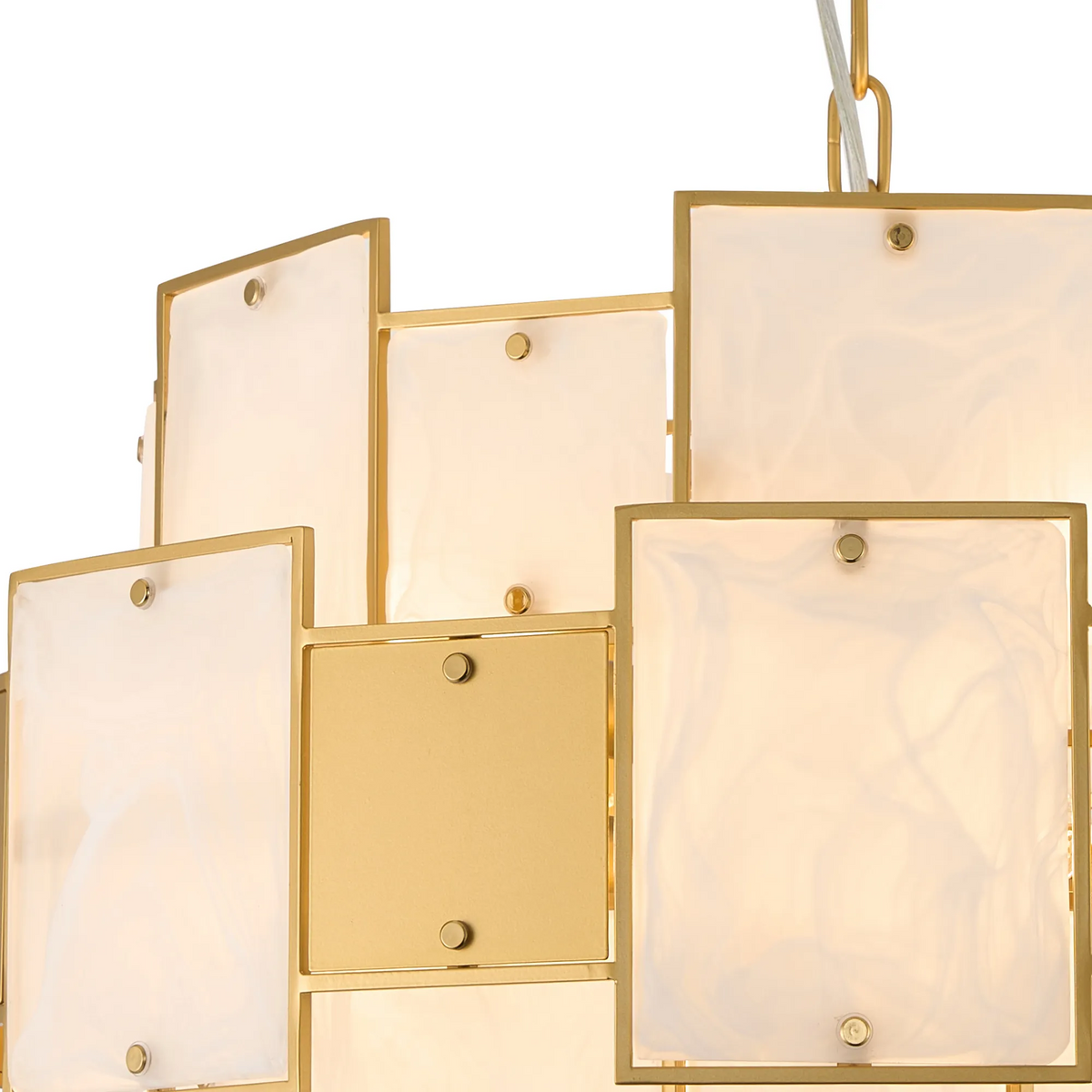 Close-up of a gold chandelier with rectangular white glass panels