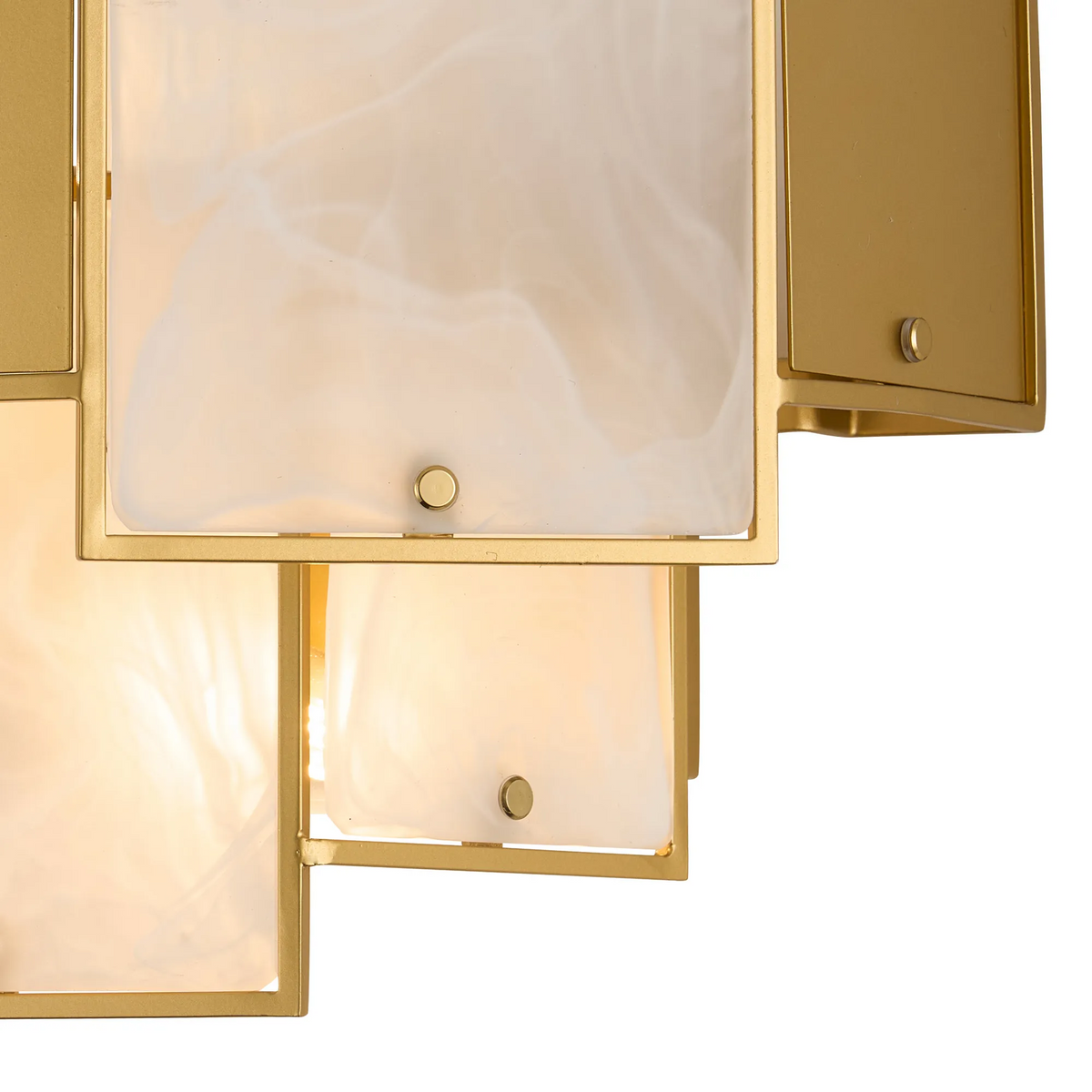 Close up of a gold chandelier with white rectangular shades
