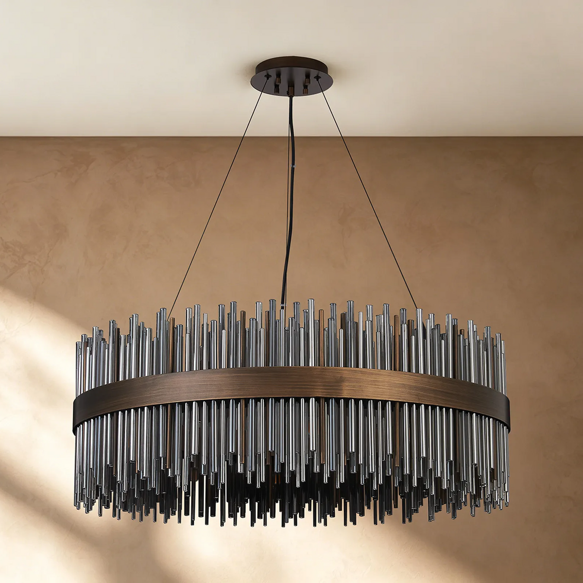 Round chandelier with bronze frame and clear glass rods