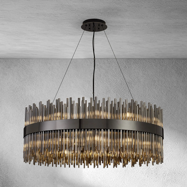 Round chandelier with dark metal frame and vertical glass rods, illuminated from within