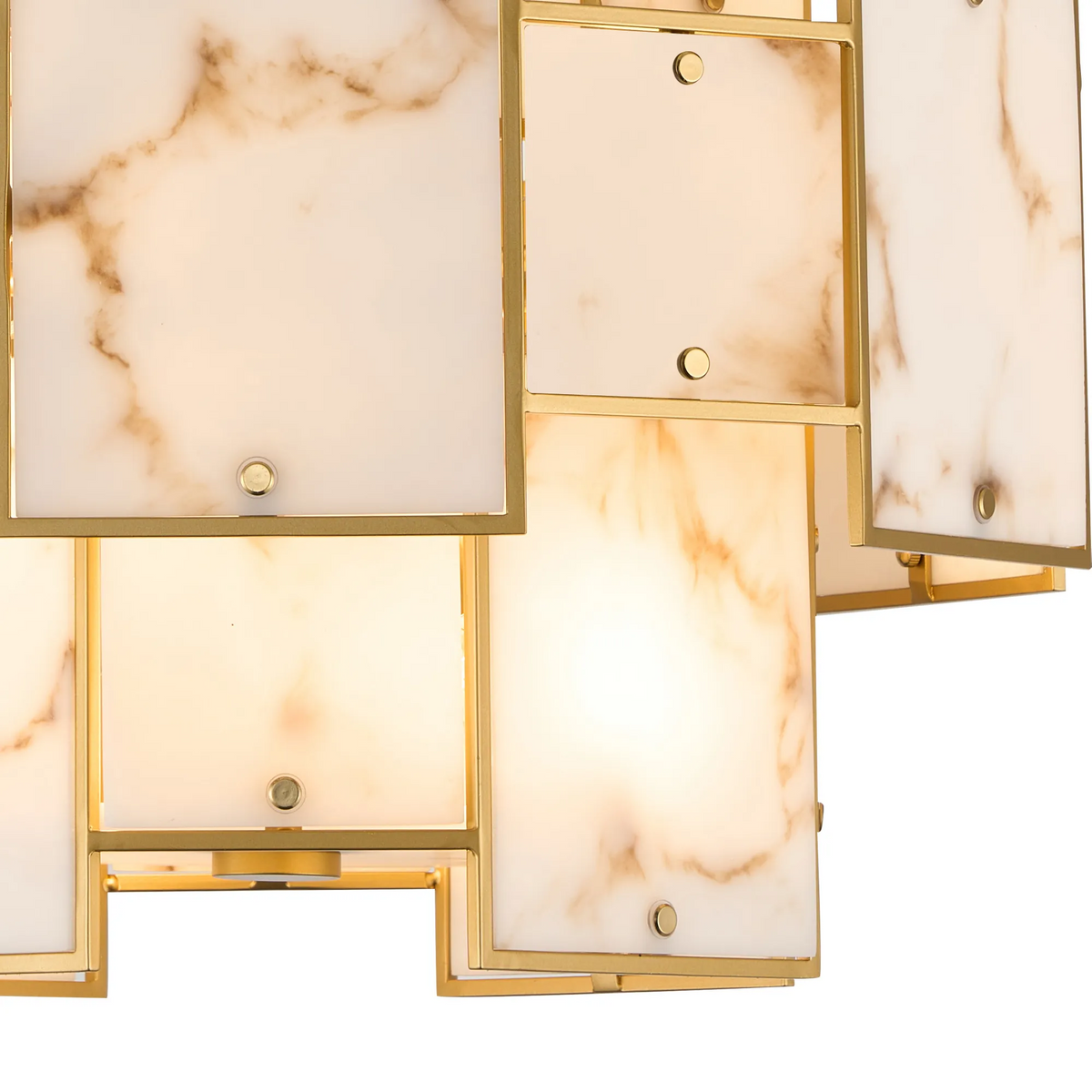 Close up of a gold chandelier with square marble panels