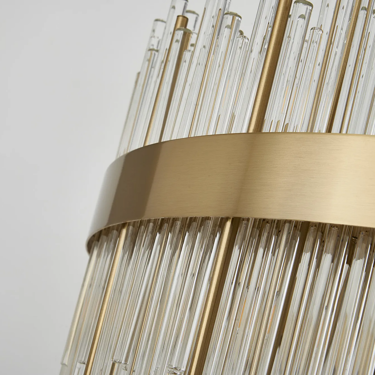 Close up of a brass and glass chandelier
