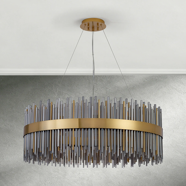 Round chandelier with gold band and clear and gold glass rods