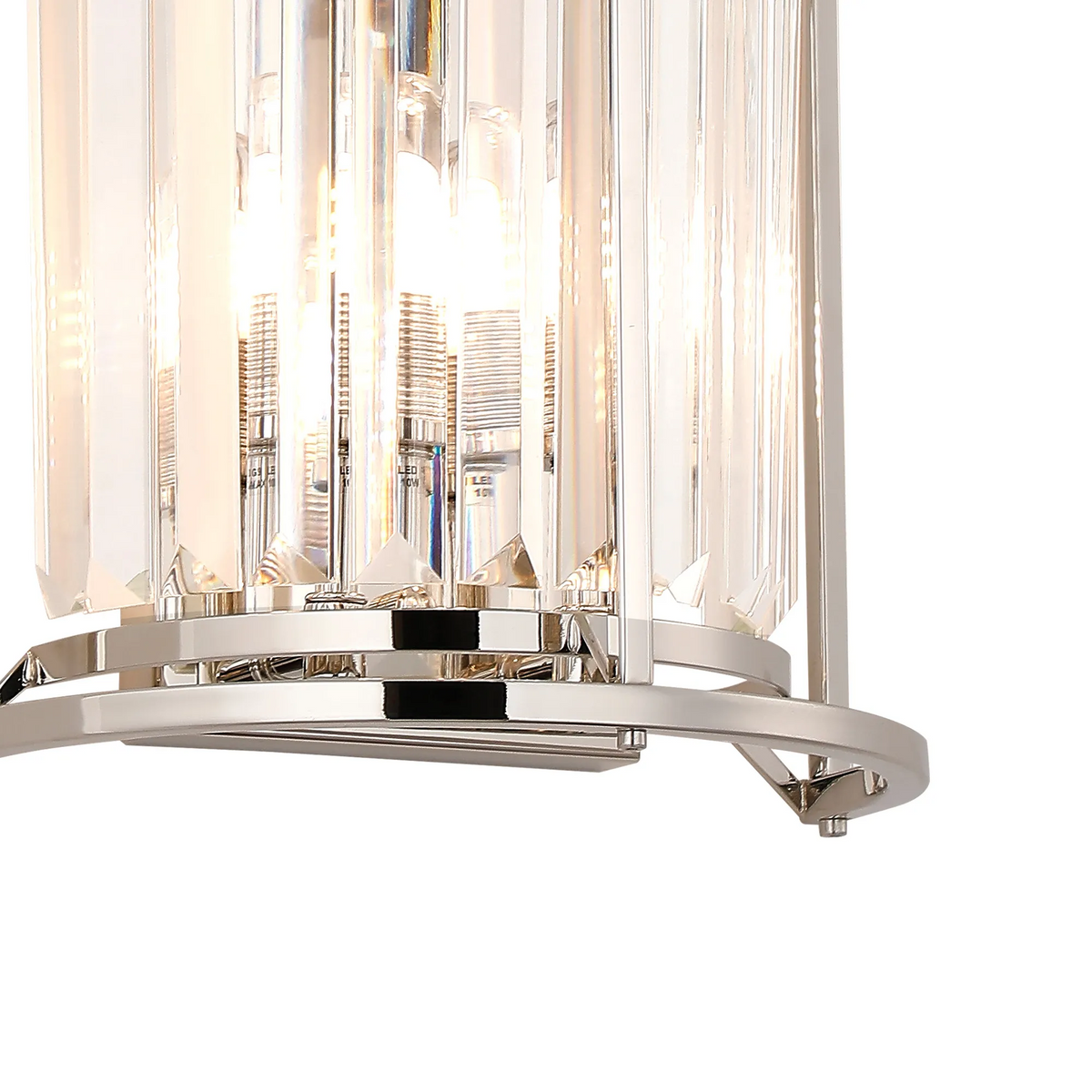 Close-up of a crystal chandelier with polished nickel accents and illuminated bulbs