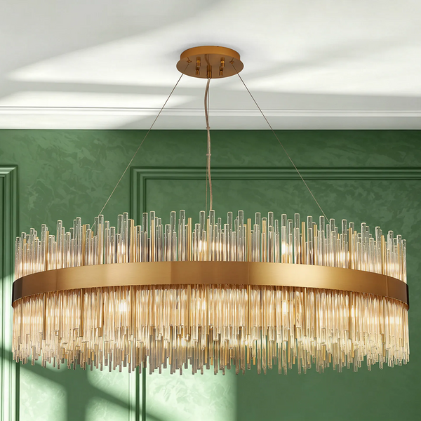 Gold chandelier with glass rods in a green room