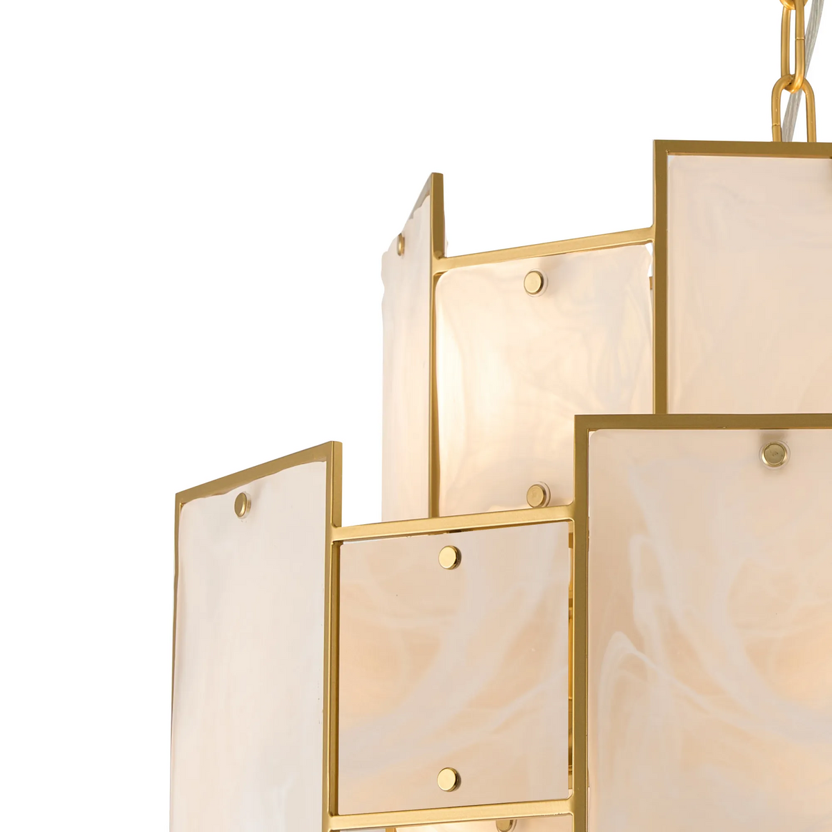 Close up of a gold chandelier with square white glass panels