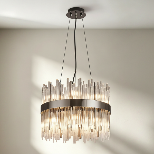 Round chandelier with a dark metal frame and clear glass rods of varying lengths