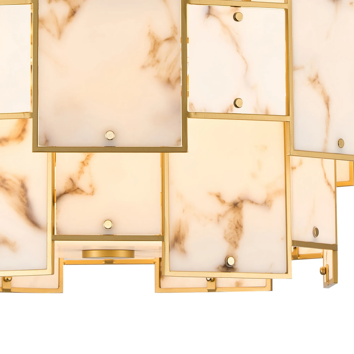 Close-up of a gold chandelier with rectangular white marble panels