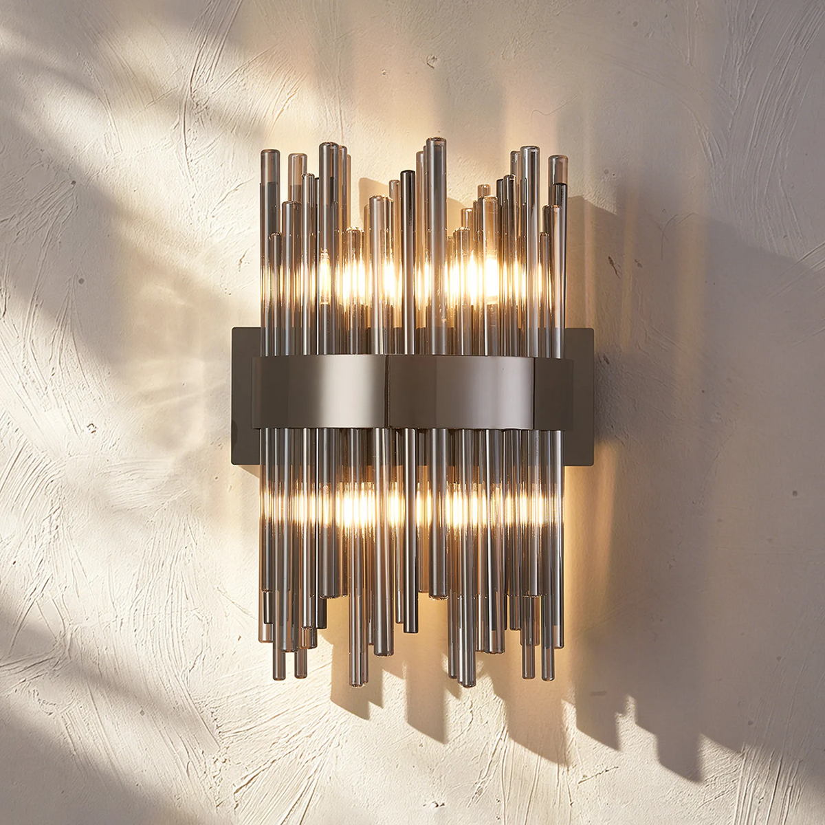 Wall sconce with multiple vertical glass tubes and internal lights