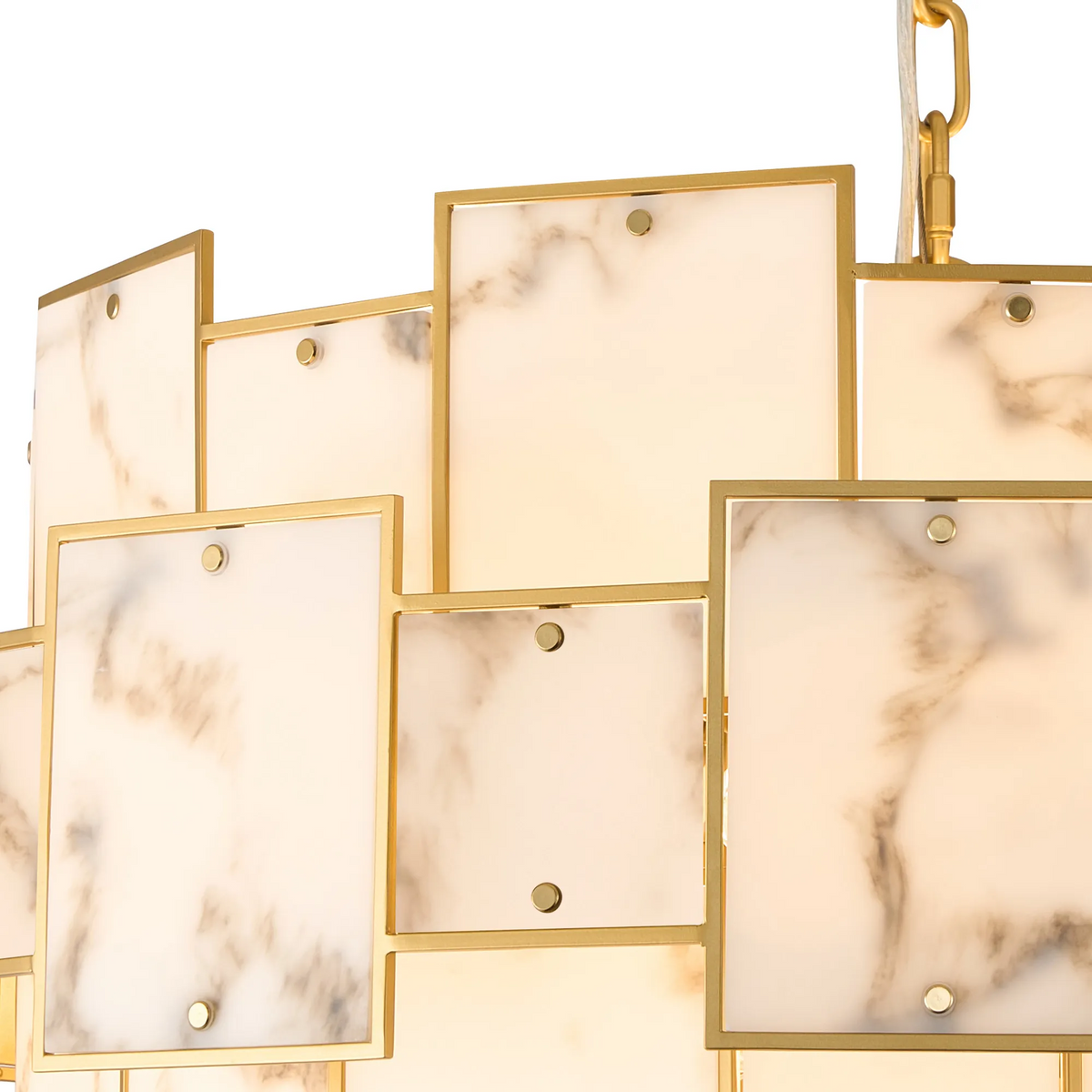 Close up of a chandelier with rectangular white marble panels framed in gold