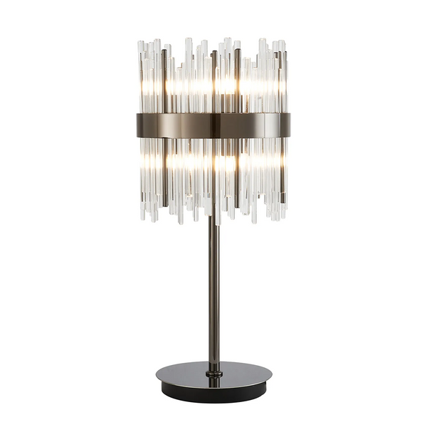 Table lamp with a dark metal base and stem, supporting a cylindrical shade made of vertical glass rods