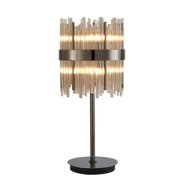 Table lamp with a dark metal base and stem, and a cylindrical shade made of vertical glass rods with internal lights