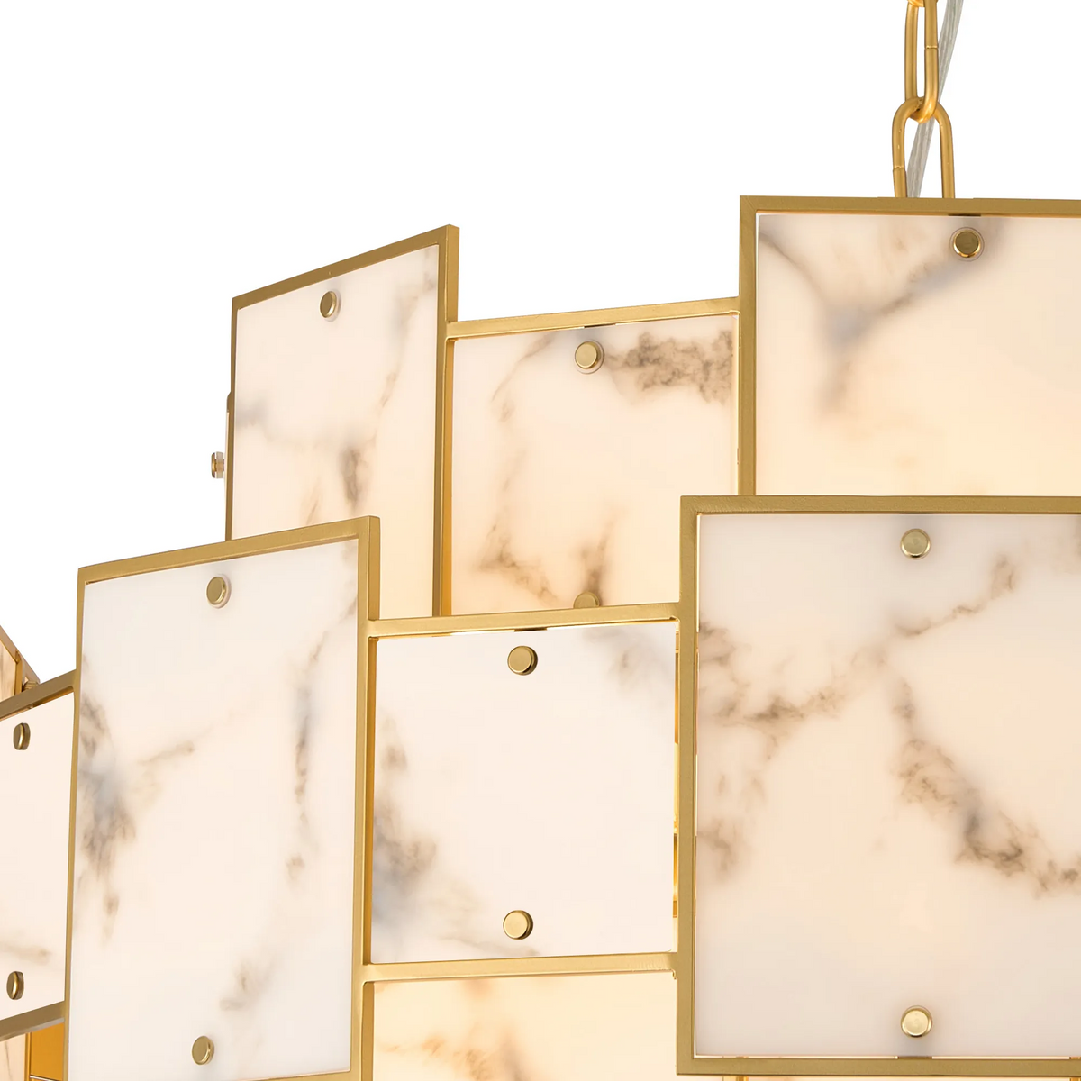 Close up of a gold chandelier with square marble panels