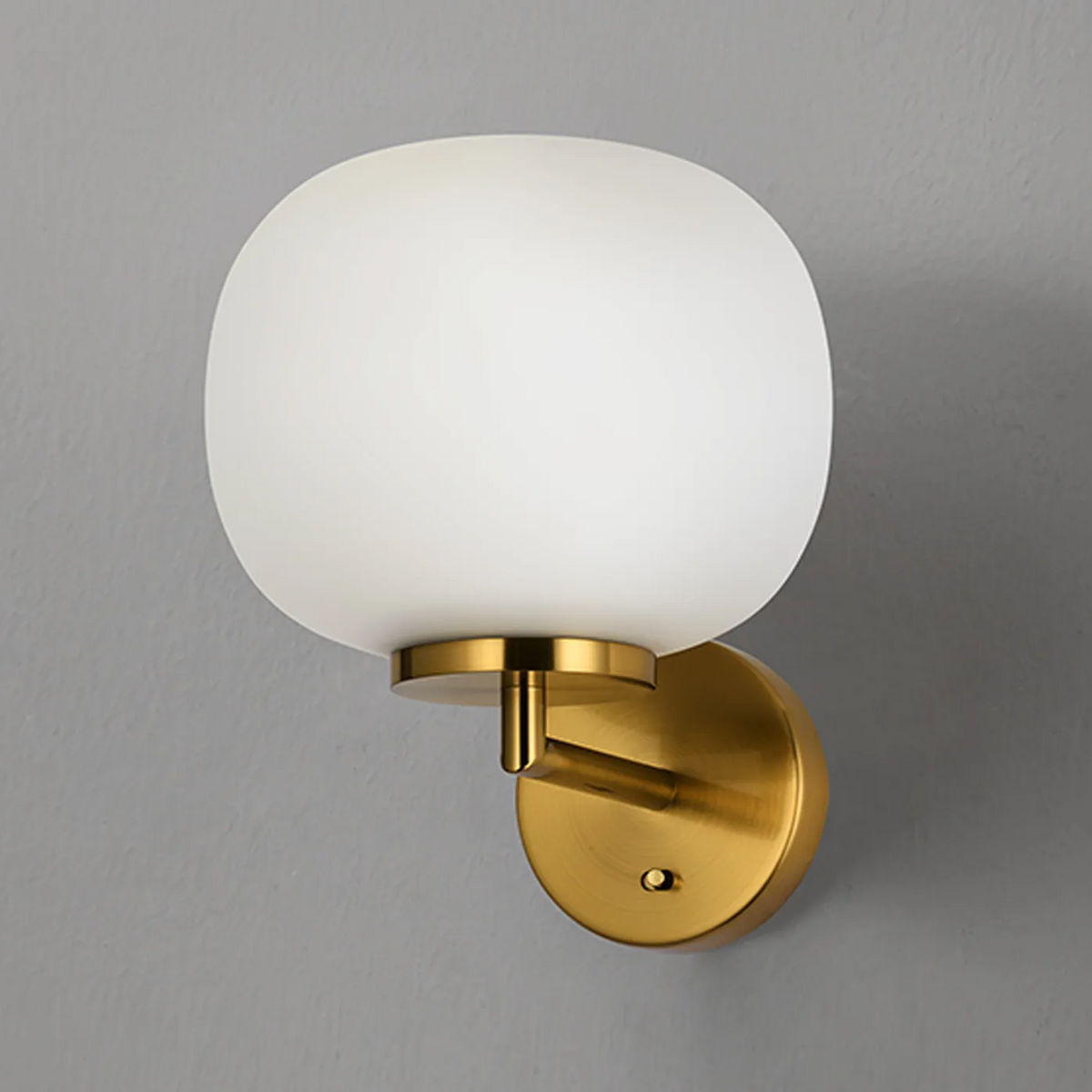 Milton Small Oval Ball Switched Wall Light in Aged Brass & Frosted White Shade