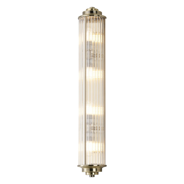 Vertical brass wall light with fluted glass shade