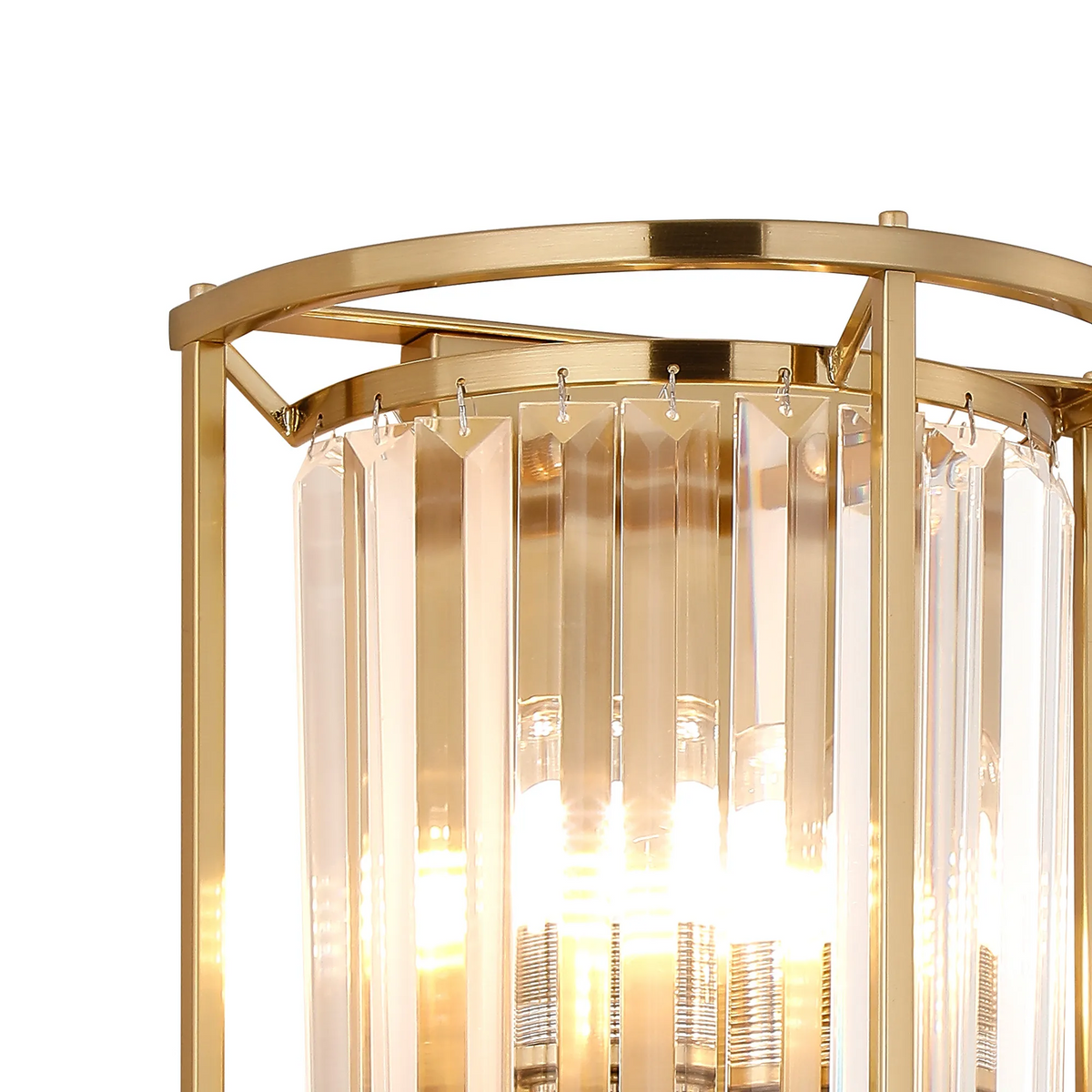 Close up of a gold chandelier with clear rectangular crystal panels and visible light bulbs