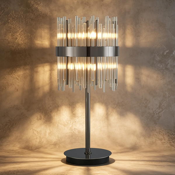 Table lamp with a black base and stem, and a cylindrical shade made of vertical glass rods