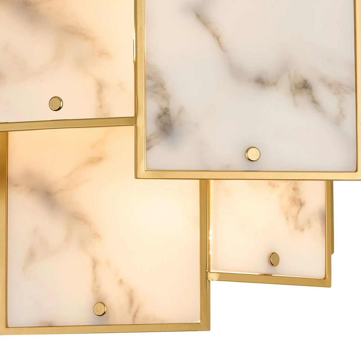 Close up of a gold framed light fixture with marble-like panels