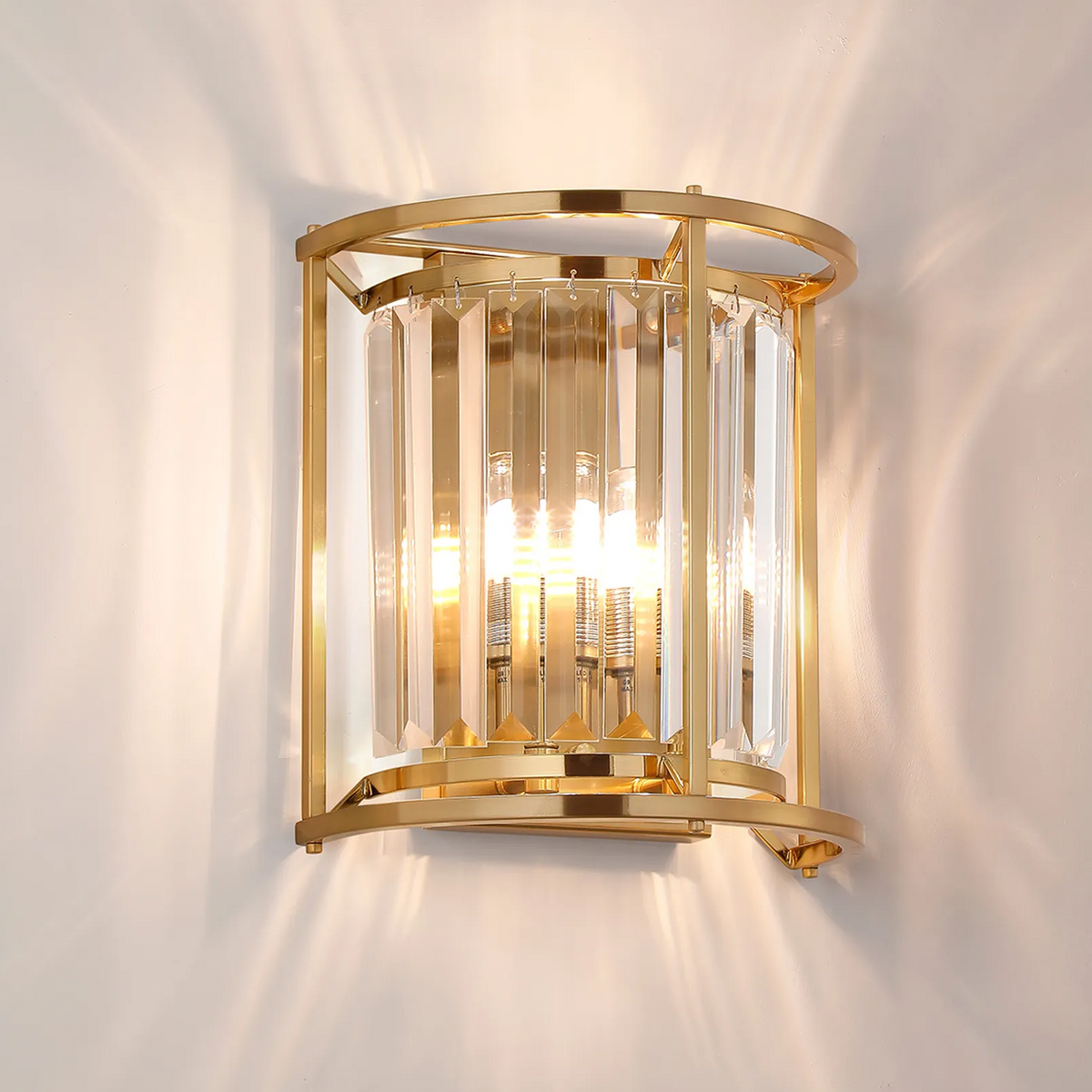 Gold wall sconce with clear crystal panels