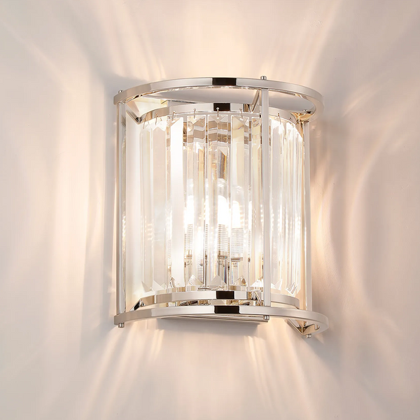 Chrome and crystal wall sconce with light shining upwards and downwards