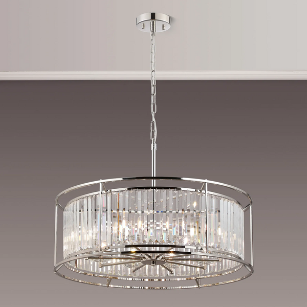 Round crystal chandelier with chrome frame and chain hanging from a ceiling
