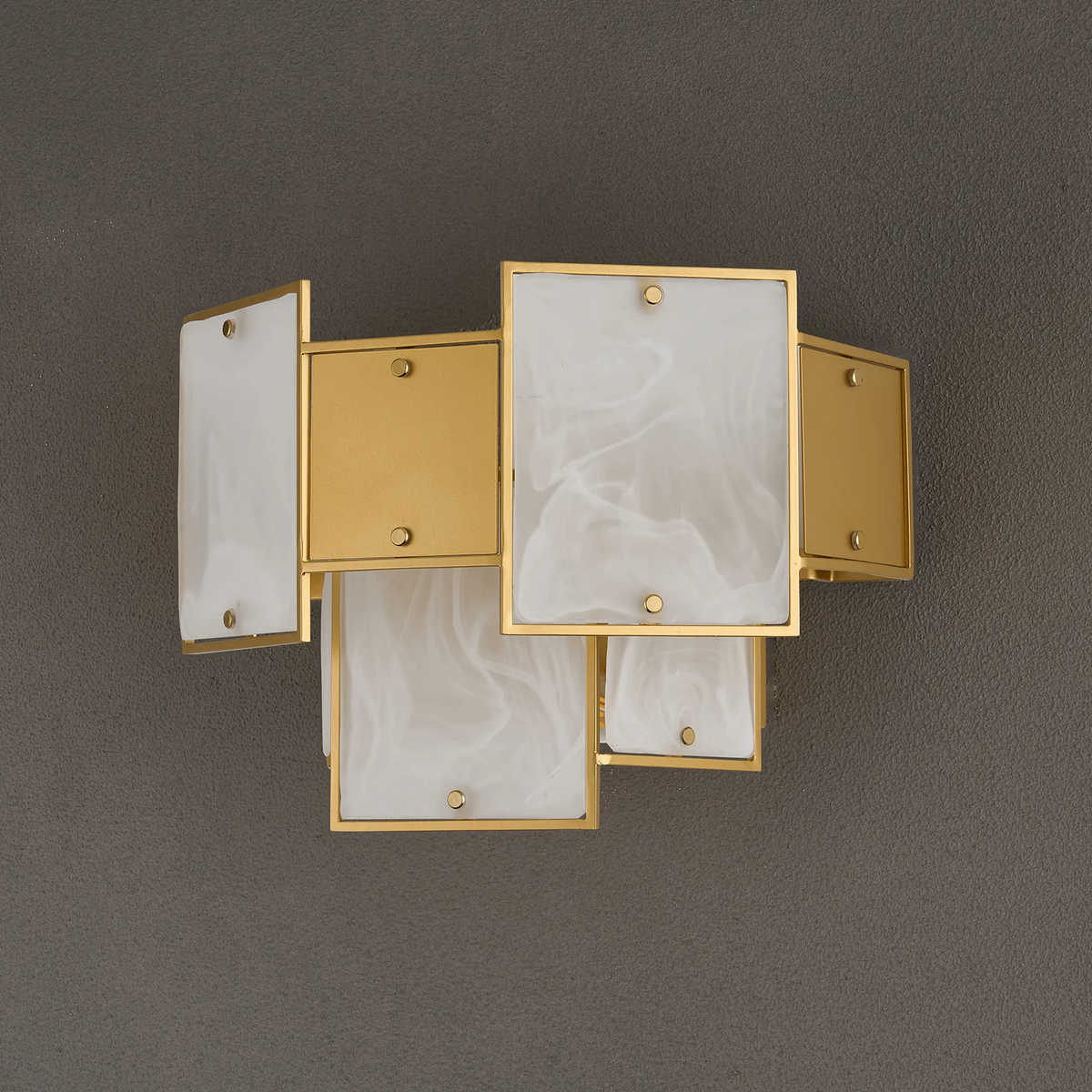 Gold wall sconce with rectangular white marble panels