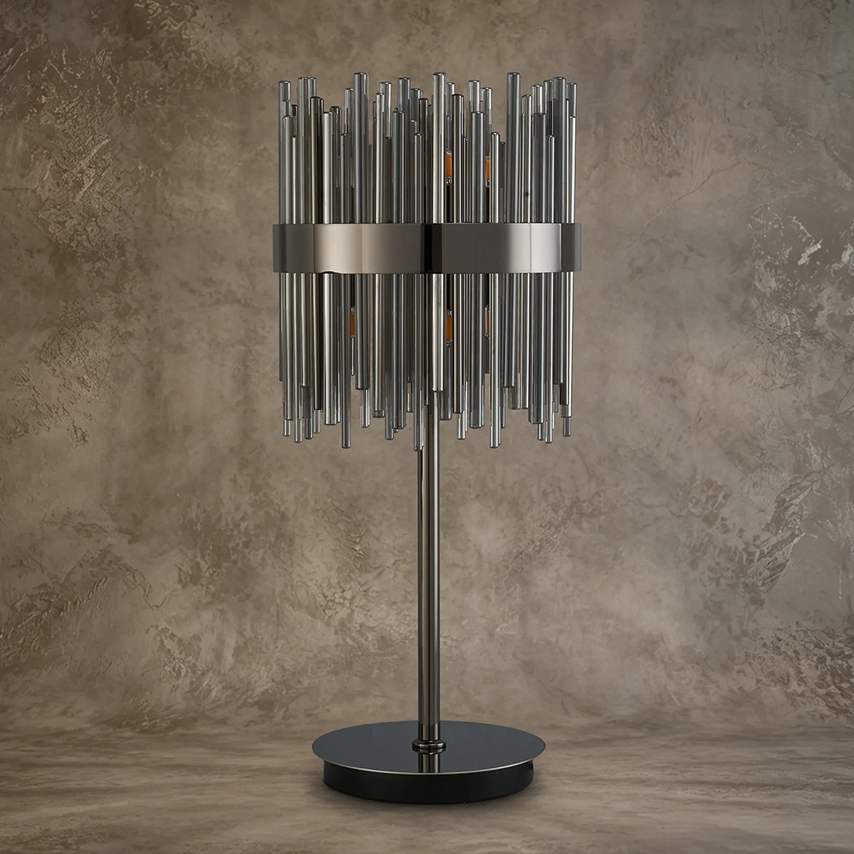 Table lamp with a cylindrical shade made of vertical metal rods, on a round base