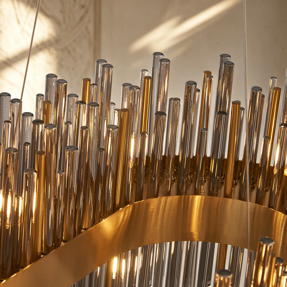 Close up of a chandelier with gold and clear glass rods