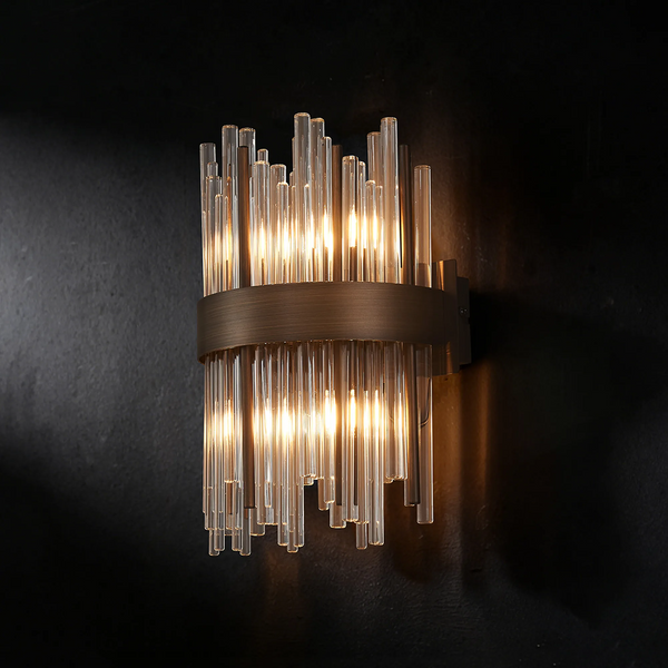 Wall mounted light fixture with clear glass tubes and a bronze band