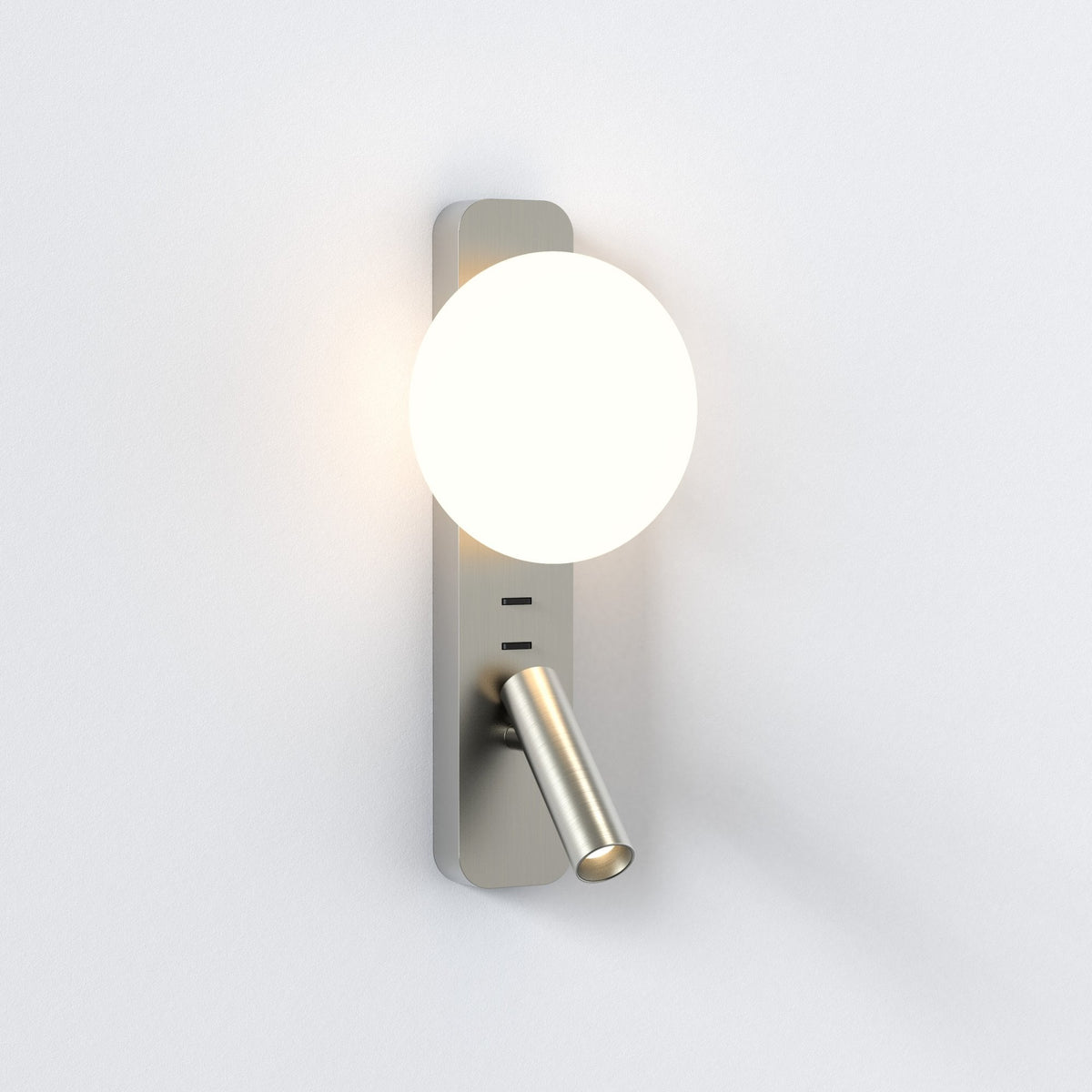 Brushed steel wall light with a round, glowing white shade and an adjustable reading light below