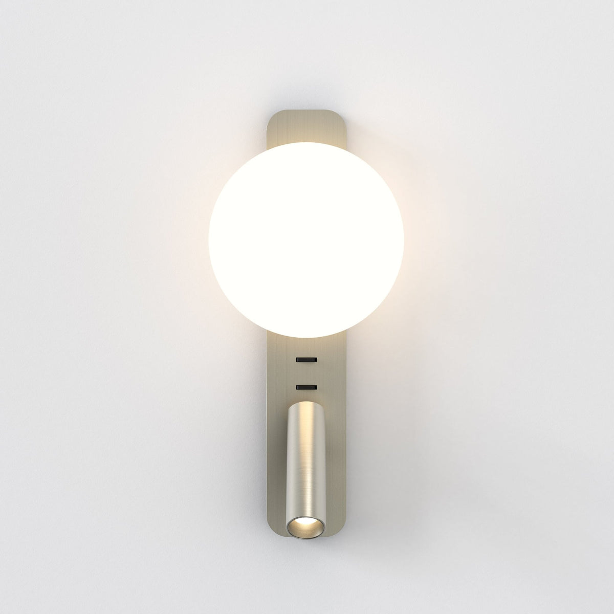 Brushed brass wall light with a large spherical light and a smaller cylindrical spotlight