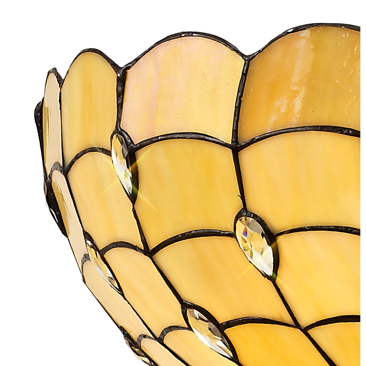 A detailed close-up of the yellow stained glass pattern with small clear crystals.