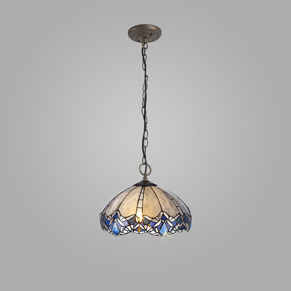 A Tiffany-style pendant light, with a blue and white patterned shade, hangs on a grey background.