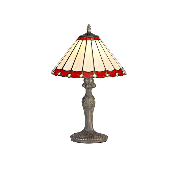 A decorative red and cream Tiffany-style table lamp with an ornate bronze base.